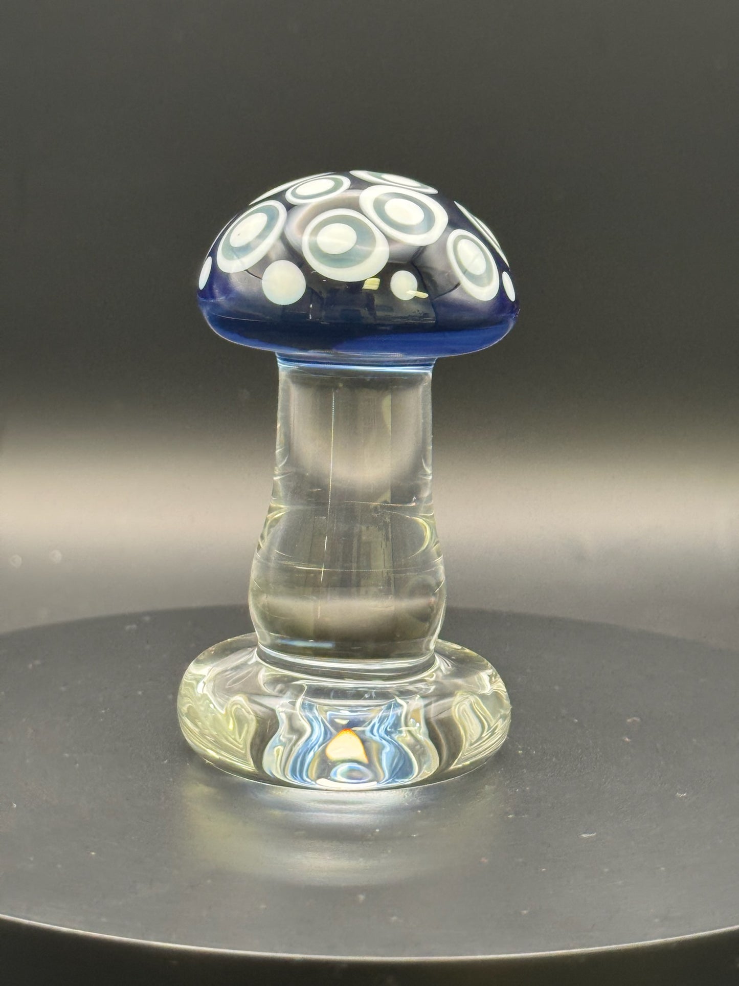 chg007 - $45 - sculpture - 2.8" clear mushroom sculpture w/ transparent blue cap and white/grey dot stacks.
